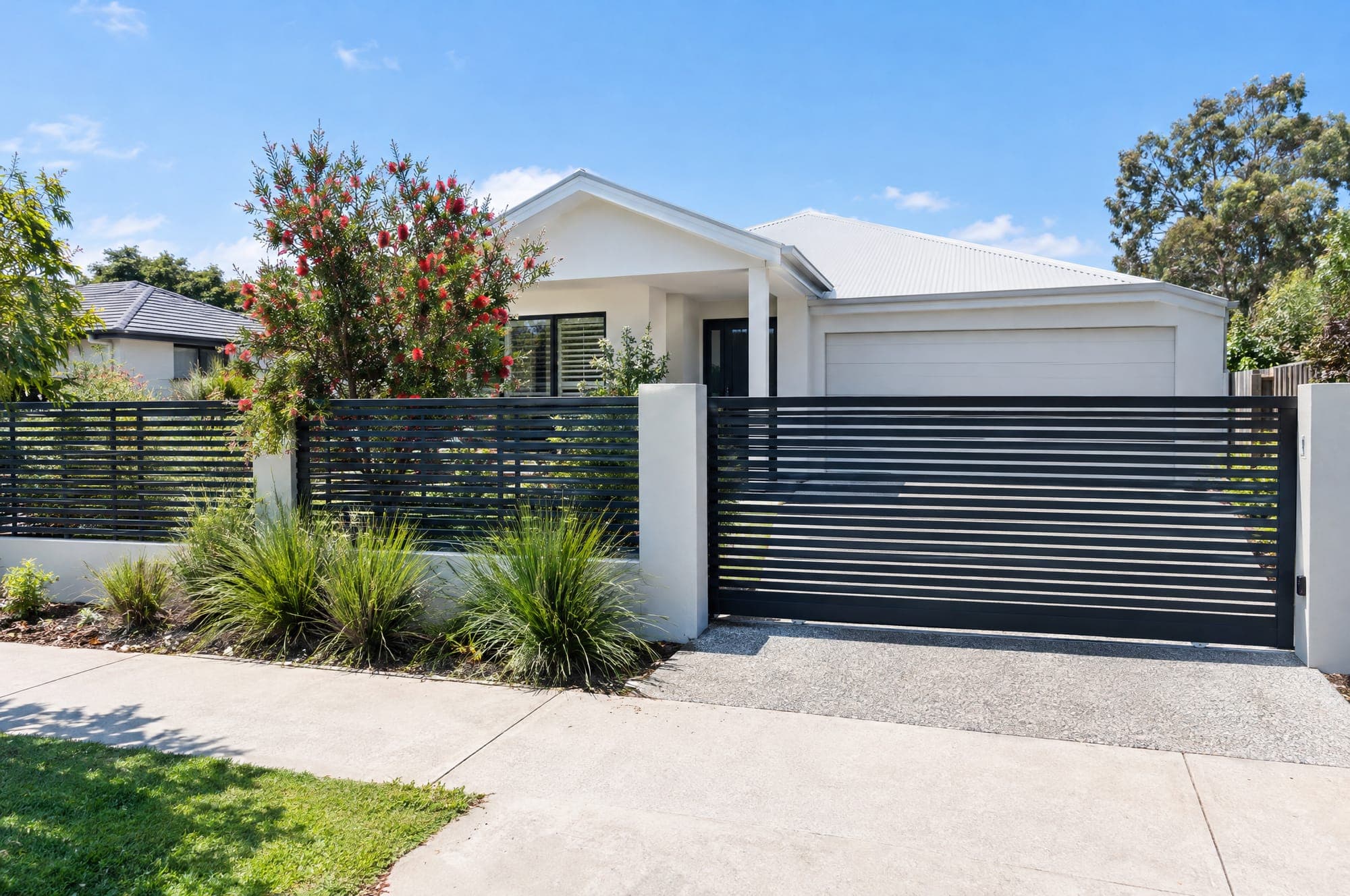 Black aluminium slat front fence and gate