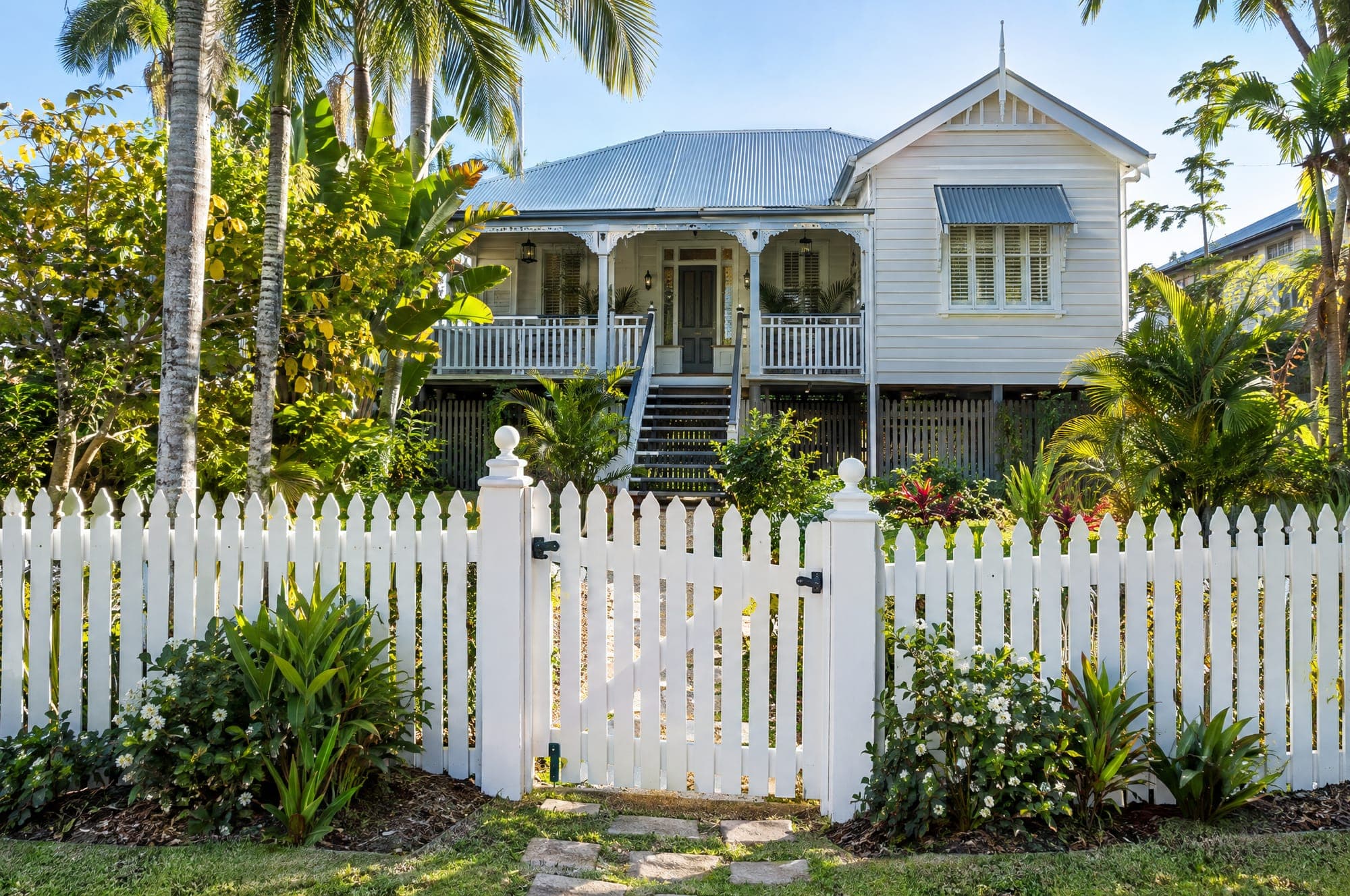 White picket fence in front of a Queenslander